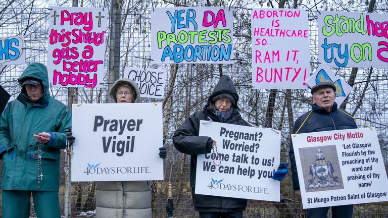 People take part in an anti-abortion protest, organised by 40 Days For Life, on Hardgate Road, close to the Queen Elizabeth University Hospital in Glasgow.