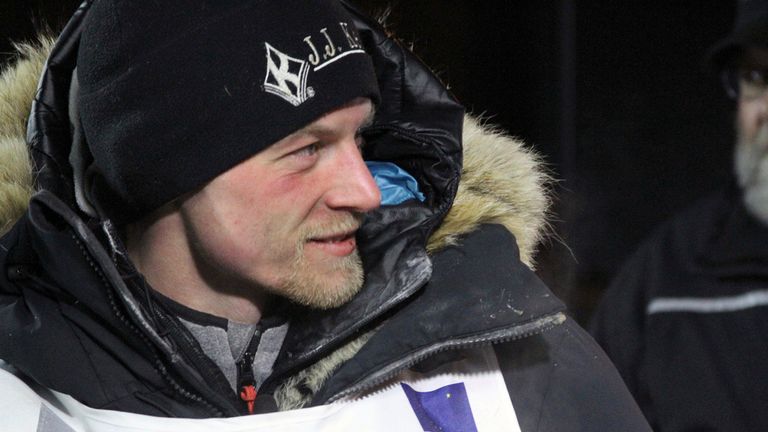 FILE - Dallas Seavey talks to officials after finishing the Iditarod Trail Sled Dog Race, March 15, 2016, in Nome, Alaska. The veteran musher had to kill a moose after it injured his dog shortly after the start of the 2024 Iditarod, race officials said Monday, March 4, 2024. (AP Photo/Mark Thiessen, File)