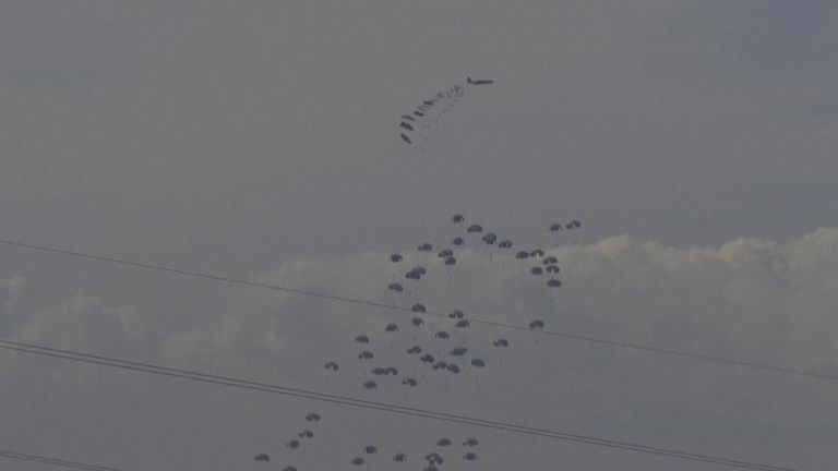 A Jordan air force&#39;s C130 Hercules air drops aid in Gaza.