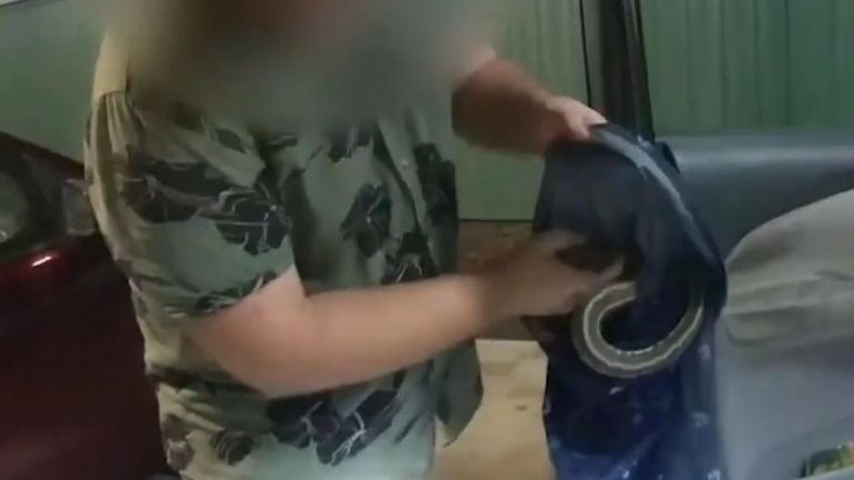 Man charged with animal cruelty after 26 snakes found in vehicle 