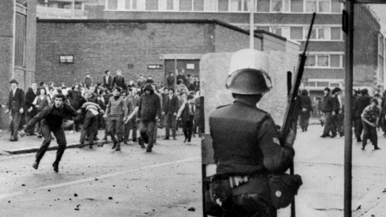 A lone British soldier watches a mob of stone -throwing Catholics at Divis Towers, Lower Falls Road.
Picture by: PA/PA Archive/PA Images
Date taken: 01-Nov-1970