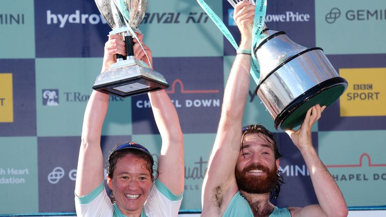 Cambridge Women's President Jenna Armstrong and Cambridge Men's President Sebastian Benzecry celebrate with the trophies after the Gemini Boat Race 2024 on the River Thames, London. Picture date: Saturday March 30, 2024.

