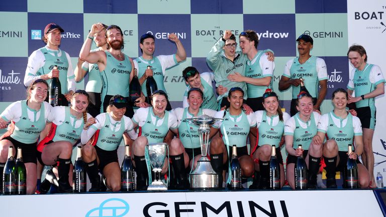 The Cambridge men's and women's teams celebrate receiving their trophies after the 2024 Gemini Rowing Race on the River Thames in London. Image date: Saturday, March 30, 2024.