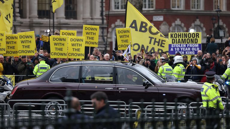 Queen Camilla waves in a vehicle as she passes by anti-monarchy protesters on the day of the annual Commonwealth Day service at Westminster Abbey.
Pic: Reuters