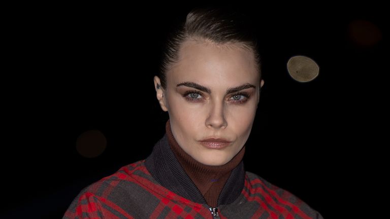 Cara Delevingne poses for photographers at the Burberry Winter 2024 fashion show in February. Pic: AP