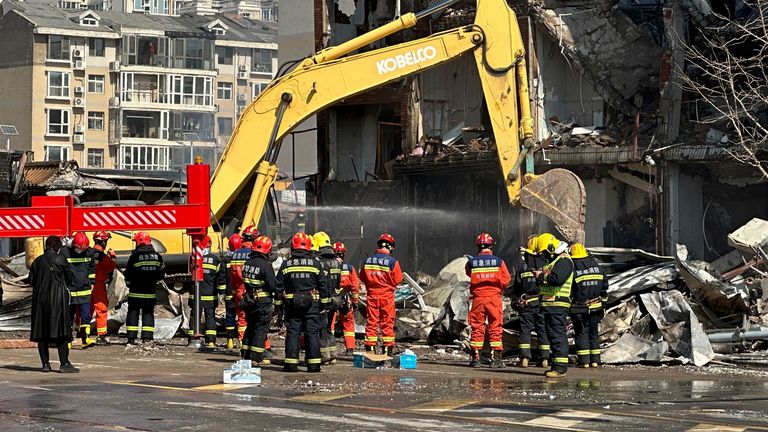 Firefighters work the scene of an explosion in Sanhe city in northern China...s Hebei province on Wednesday, March 13, 2024. Rescuers were responding to a suspected gas leak explosion Wednesday in a building in northern China, authorities said. (AP Photo/Ng Han Guan)
