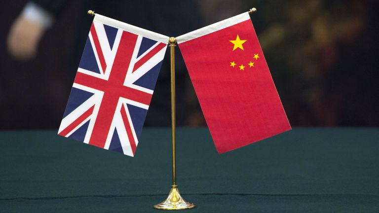 A UK and Chinese flag. Pic: PA