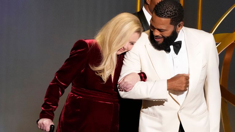 Christina Applegate, left, and Anthony Anderson appear during the 75th Primetime Emmy Awards on Monday, Jan. 15, 2024, at the Peacock Theater in Los Angeles. (AP Photo/Chris Pizzello)