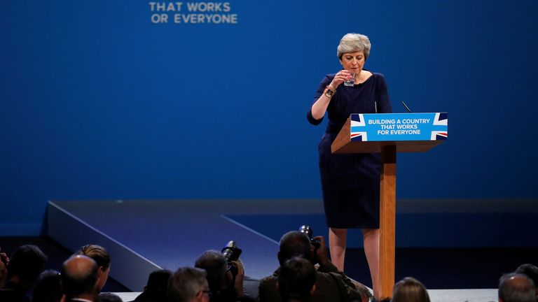 The wording on a slogan is changed after a letter fell away from the backdrop as Britain&#39;s Prime Minister Theresa May addresses the Conservative Party conference
Pic: Reuters