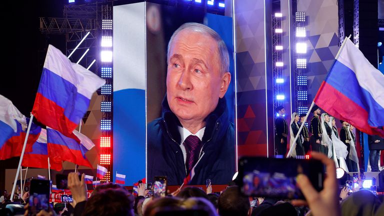 Vladimir Putin at a rally to mark the 10th anniversary of the Russian annexation of Crimea. Pic: Reuters