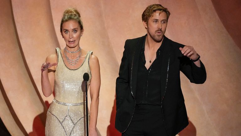 Emily Blunt, left, and Ryan Gosling speak during the Oscars on Sunday, March 10, 2024, at the Dolby Theatre in Los Angeles. (AP Photo/Chris Pizzello)