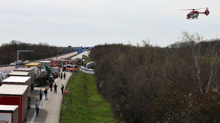 Pic: (Jan Woitas/dpa/AP
Emergency vehicles and a rescue helicopter work at the scene of the accident on the A9, near Schkeuditz, Germany, Wednesday, March 27. 2024. (Jan Woitas/dpa via AP)