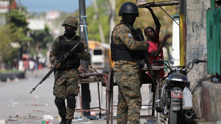 Police officers patrol Port-au-Prince. Pic: Reuters