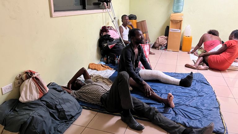 Injured men in the communications ministry building