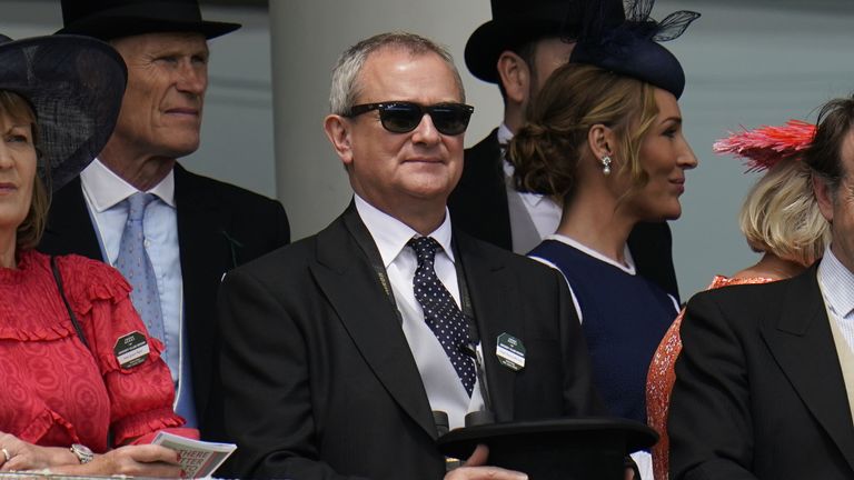Hugh Bonneville in the stands on Derby Day during the Cazoo Derby Festival 2022 at Epsom Racecourse, Surrey. Picture date: Saturday June 4, 2022.
