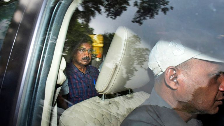 Arvind Kejriwal, leader of the Aam Admi Party, or Common Man&#39;s Party, left, leaves in a car after a court extended his custody for four more days, in New Delhi, India, Thursday, March 28, 2024. Kejriwal, New Delhi...s top elected official and one of the country...s most consequential politicians of the past decade, was arrested by the federal Enforcement Directorate on March 21. (AP Photo/Dinesh Joshi)