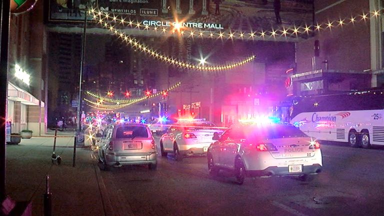 Police patrol the area of the shooting. Pic: WRTV via AP