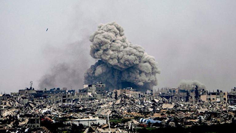 Smoke and explosions rise inside the Gaza Strip, as seen from southern Israel.
Pic: AP