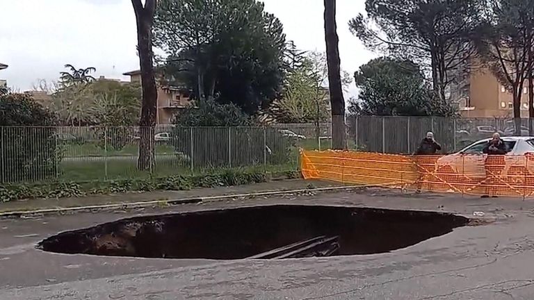 Large sinkhole swallows two cars in Rome