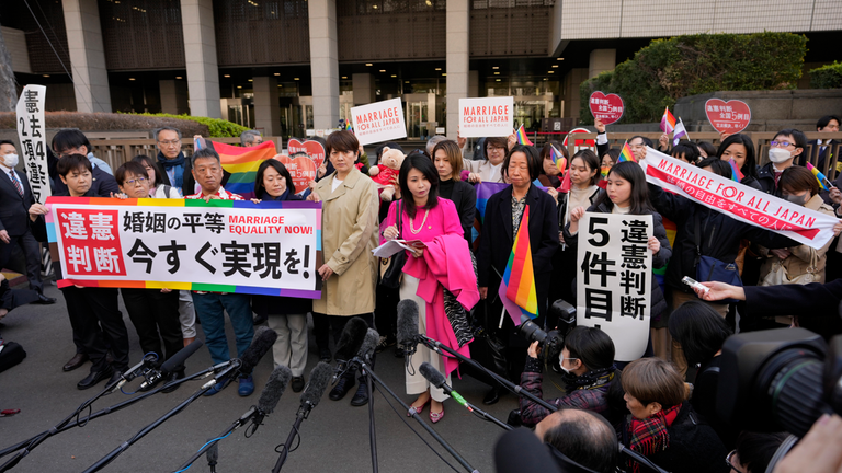 The plaintiffs outside the court before the ruling in Tokyo. Pic: AP