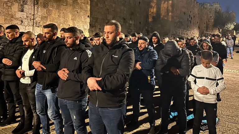 Ramadan in Jerusalem, Lines of men pray outside the old city walls as Israeli security bar them from entering. 