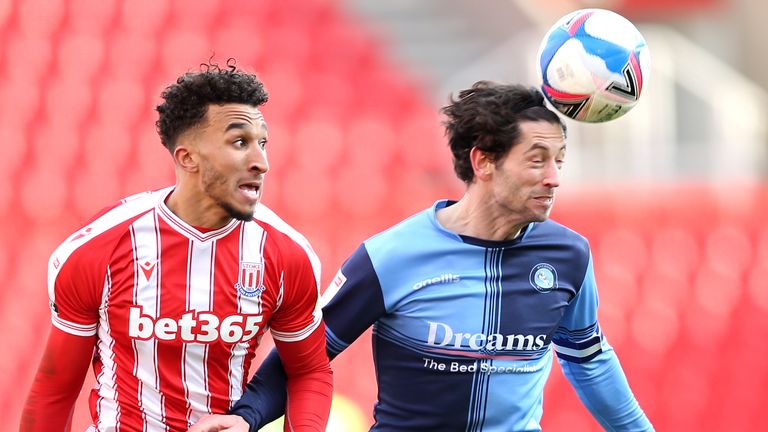 Stoke City&#39;s Jacob Brown (left) and Wycombe Wanderers&#39; Joe Jacobson battle for the ball. Pic: PA