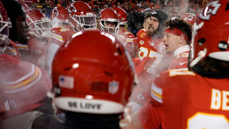 FILE -  Kansas City Chiefs quarterback Patrick Mahomes, second from right, and tight end Travis Kelce, third from right, huddle with teammates before an NFL wild-card playoff football game against the Miami Dolphins Saturday, Jan. 13, 2024, in Kansas City, Mo. Some of the people who attended the near-record cold Chiefs playoff game in January had to undergo amputations, a Missouri hospital said Friday, March 8, 2024. Research Medical Center didn...t provide exact numbers but said in a statement 