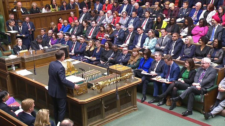 Jeremy Hunt during the budget as Keir Starmer reacts