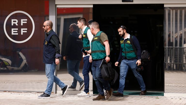 A Europol agent and several agents from the Guardia Civil&#39;s Central Operational Unit (UCO) leave the Royal Spanish Football Federation (RFEF), on March 20, 2024, in Madrid, Spain. J.Barroso/AFP7 / Europa Press 03/20/2024 (Europa Press via AP)