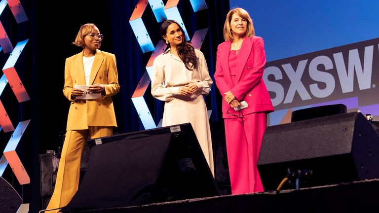Meghan, Duchess of Sussex, waits for other panellists to take the stage during a keynote speech on women&#39;s representation in media and entertainment in Austin, Texas, on International Women&#39;s Day 2024. Also pictured are Errin Haines, left, and Katie Couric, right. Pic: Reuters