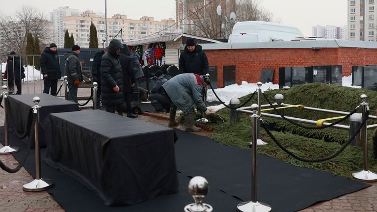 Workers prepare the burial site. Pic: AP