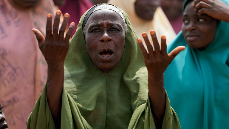A women prays for the kidnapped LEA Primary and Secondary School students in Kuriga, Kaduna state. Pic: AP