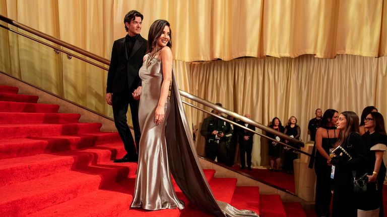 John Mulaney, left, and Olivia Munn arrive at the Oscars on Sunday, March 10, 2024, at the Dolby Theatre in Los Angeles. (AP Photo/John Locher)