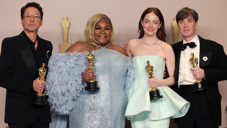 Cillian Murphy, winner of the Best Actor Oscar for "Oppenheimer", joins Emma Stone, winner of the Best Actress Oscar for "Poor Things", Da'Vine Joy Randolph, Best Supporting Actress Oscar winner for "The Holdovers", and Robert Downey Jr., Best Supporting Actor Oscar winner for "Oppenheimer", in the Oscars photo room at the 96th Academy Awards in Hollywood, Los Angeles, California, U.S., March 10, 2024. REUTERS/Carlos Barria
