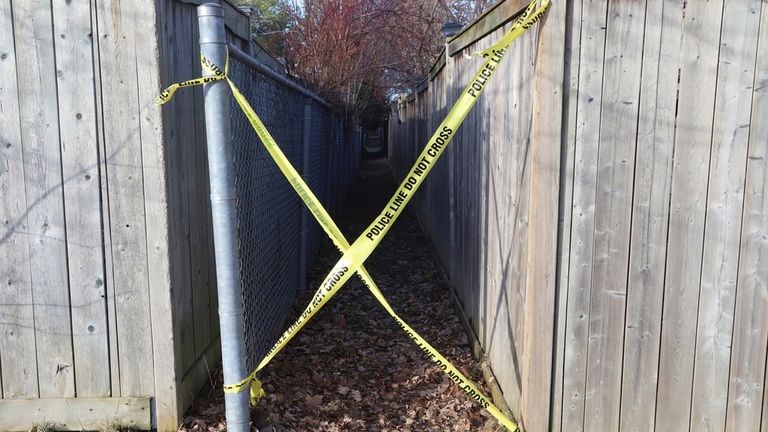 Police tape blocks access to an alleyway at the scene Pic: Patrick Doyle/The Canadian Press/ AP