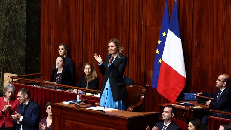 Yael Braun-Pivet, President of the French National Assembly, applauds after French lawmakers enshrined the right to abortion in its constitution, during a special congress gathering both the upper and lower houses of the French parliament (National Assembly and Senate), at the Versailles Palace near Paris, France, March 4, 2024. REUTERS/Stephanie Lecocq