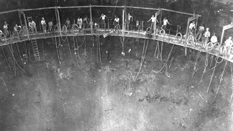In this photo provided by the U.S. Army Corps of Engineers, this 1942 Navy photo shows miners building one of the 20 fuel tanks of Defense Logistics Agency&#39;s Red Hill Underground Fuel Storage Facility at Joint Base Pearl Harbor, Hawaii, which are connected by a miles-long tunnel. A Navy investigation released Thursday, June 30, 2022 revealed that shoddy management and human error caused fuel to leak into Pearl Harbor&#39;s tap water last year, poisoning thousands of people and forcing military families to evacuate their homes for hotels. The investigation is the first detailed account of how jet fuel from the Red Hill Bulk Fuel Storage Facility, a massive World War II-era military-fun tank farm in the hills above Pearl Harbor, leaked into a well that supplied water to housing and offices in and around Pearl Harbor. (U.S. Army Corps of Engineers via AP)