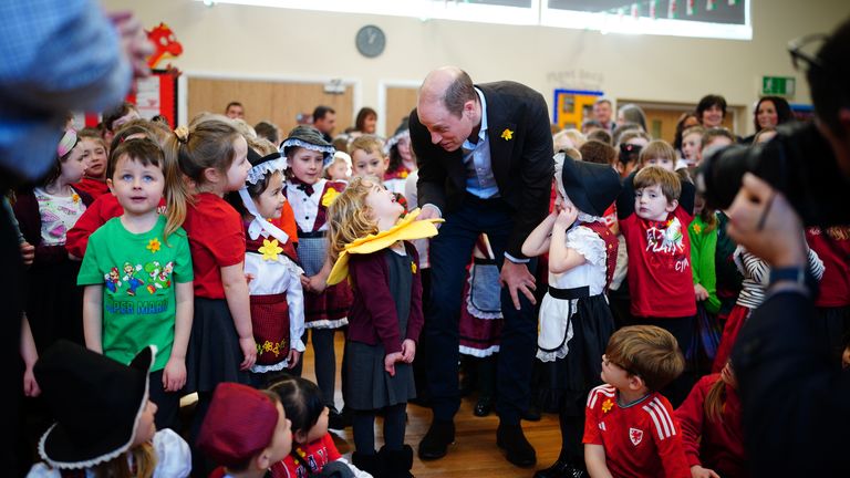 The prince pictured meeting four-year-old Esme Dale at Ysgol Yr Holl Saint/All Saint&#39;s School Pic: PA / Ben Birchall
