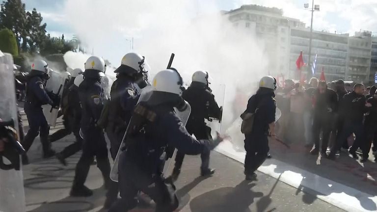 Police clash with protesters outside Greek parliament.