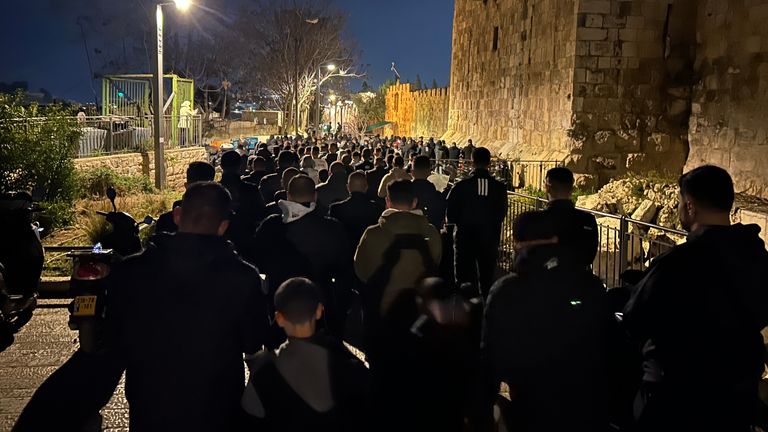 Ramadan in Jerusalem, Lines of men pray outside the old city walls as Israeli security bar them from entering. Pic: Dominic Waghorn