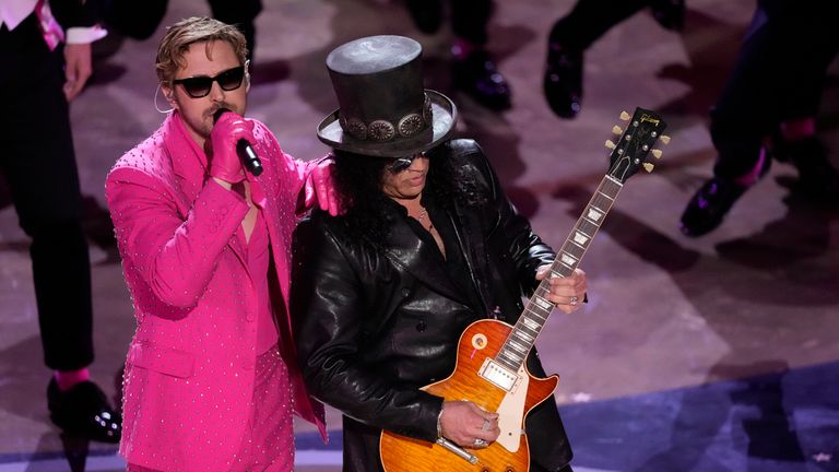 Ryan Gosling, left, performs the song "I&#39;m Just Ken" from the movie "Barbie" with Slash, right, playing the guitar during the Oscars on Sunday, March 10, 2024, at the Dolby Theatre in Los Angeles. (AP Photo/Chris Pizzello)