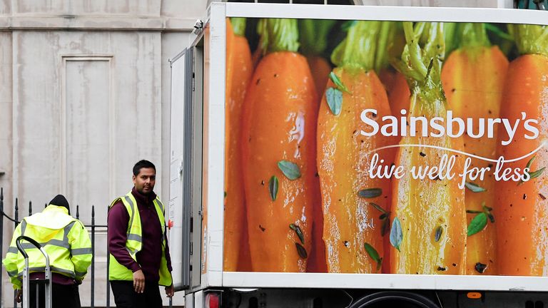 Workers unload a Sainsbury's home delivery van in central London, Britain, April 30, 2018. REUTERS/Toby Melville