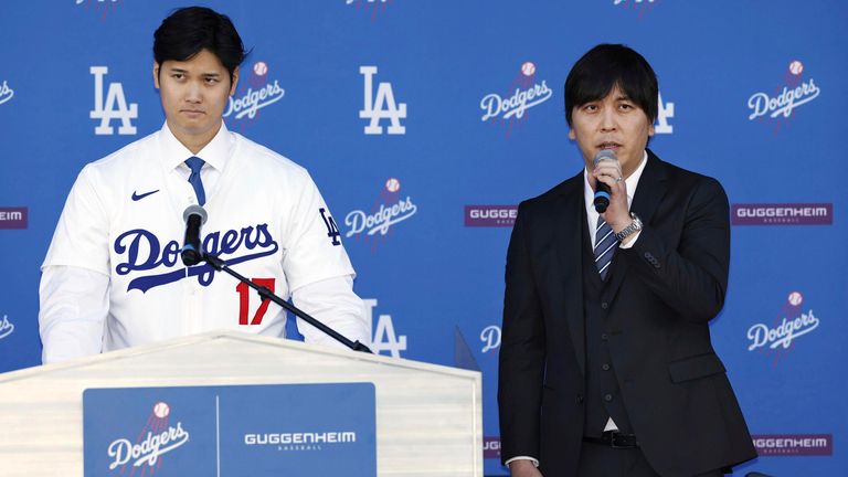 Los Angeles Dodger Shohei Ohtani (L) at a news conference with his interpreter  and friend Ippei Mizuhara in December 2023. Pic: Kyodo via AP