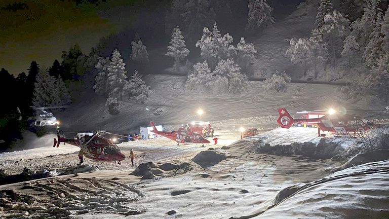 Mountain rescuers and helicopters participate in a rescue mission the Tete Blanche mountain in the Swiss alps mountains, near Sion, Switzerland, Sunday, March 10, 2024. Five cross-country skiers have been found dead after going missing over the weekend near Switzerland...s famed Matterhorn, Swiss police said Monday. Rescue authorities announced a search in difficult weather conditions Sunday for six skiers missing. The group set off Saturday on a route between the resort town of Zermatt, at the foot of the Matterhorn, and the village of Arolla, near the border with Italy. (Valais cantonal police via AP)