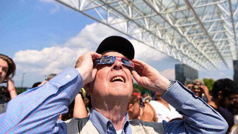 An American stares at the sun during the 2017 eclipse. Pic: AP