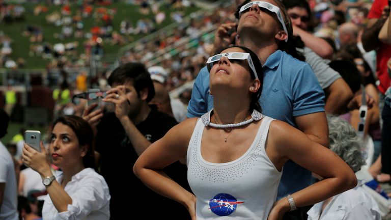 Guests watch the sun re-emerge after a total eclipse at the football stadium at Southern Illinois University in Carbondale in 2017. Pic: Reuters