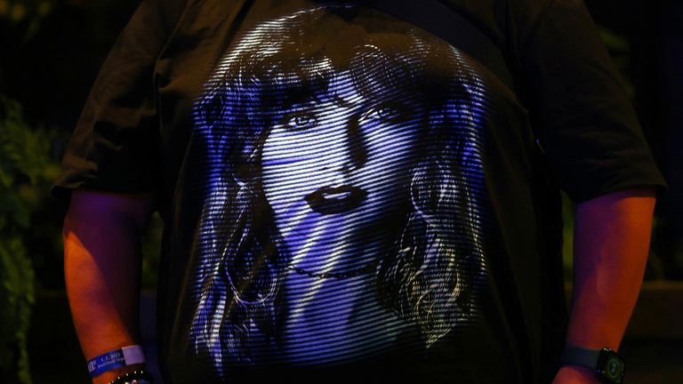 A fan shows off his Taylor Swift t-shirt at a singing event in Singapore.  Photo: Reuters