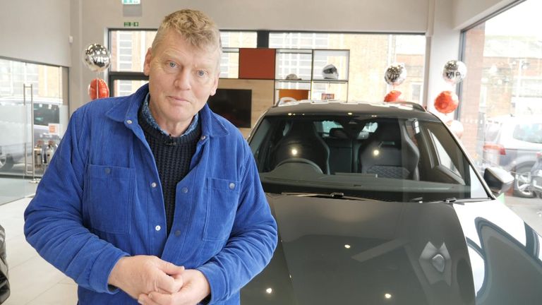 Tom Heap in front of an SUV