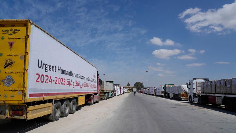 Egyptian humanitarian aids trucks line up to cross the Rafah border crossing between Egypt and the Gaza Strip, Saturday, March 23, 2024. (AP Photo/Amr Nabil)