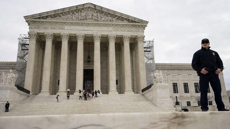 A Supreme Court police officer stands outside the United States Supreme Court building after justices unanimously reversed a Dec. 19, 2023 decision by Colorado's top court to kick Donald Trump off the state's Republican primary ballot, in Washington, U.S., March 4, 2024. REUTERS/Kevin Lamarque